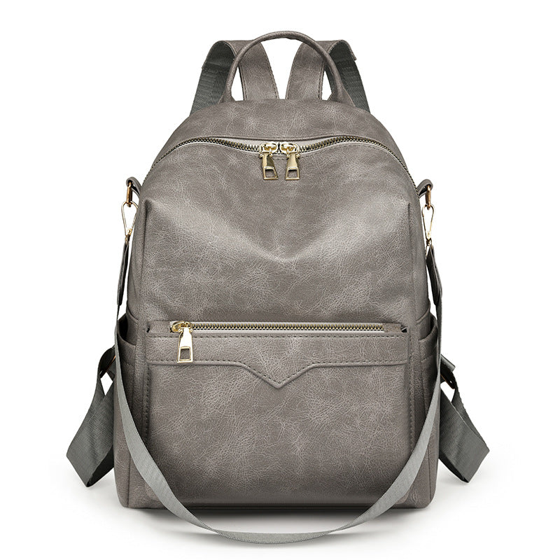Sac à dos élégant pour femme, de couleur unie, idéal pour les trajets quotidiens et offrant une grande capacité.