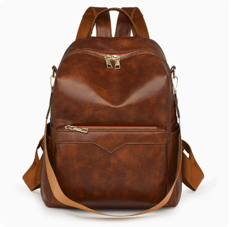 Sac à dos élégant pour femme, de couleur unie, idéal pour les trajets quotidiens et offrant une grande capacité.