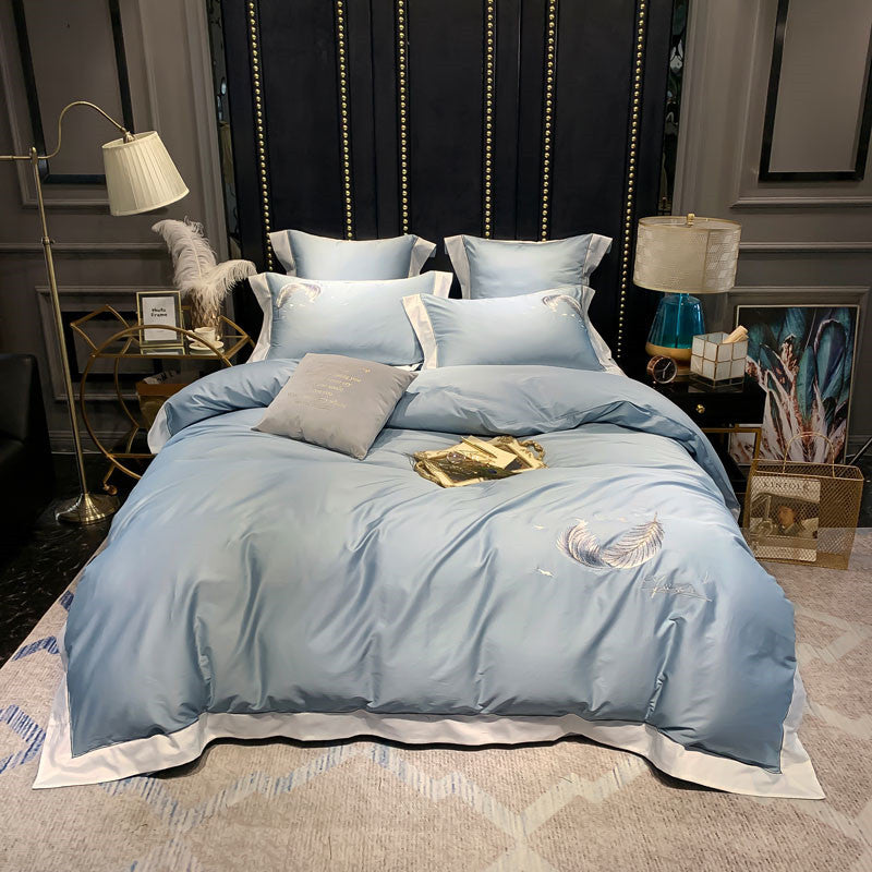 Parure de lit en coton égyptien soyeux et plumes de luxe