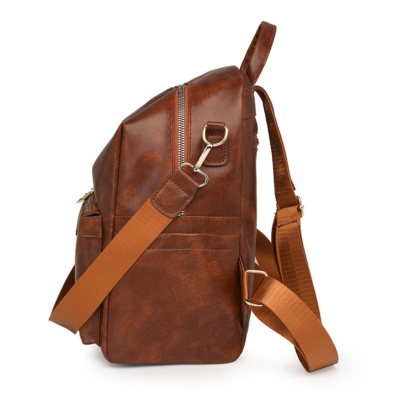 Sac à dos élégant pour femme, de couleur unie, idéal pour les trajets quotidiens et offrant une grande capacité.