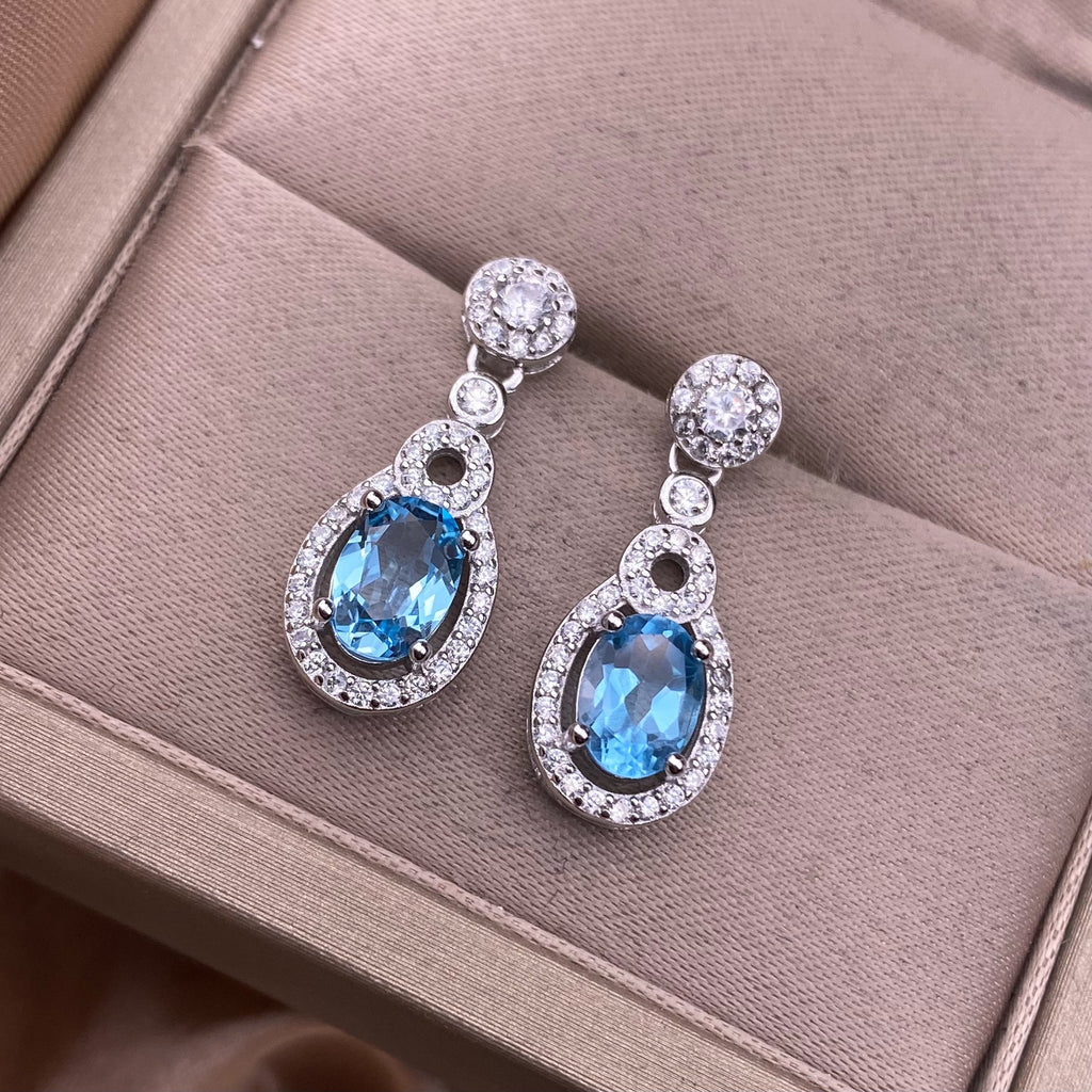 Boucles d'oreilles en topaze bleue serties de diamants en argent S925