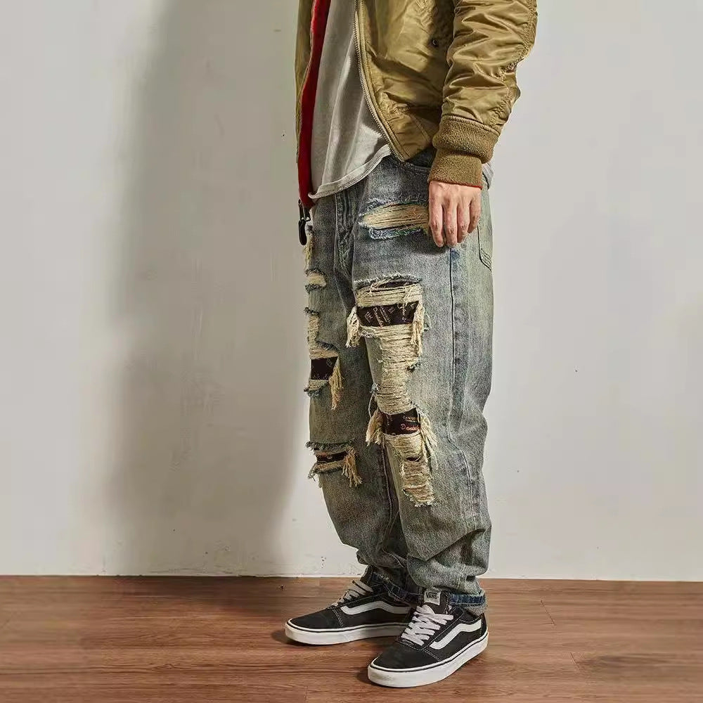 Jeans homme coupe droite ample et fuselée, effet usé et troué
