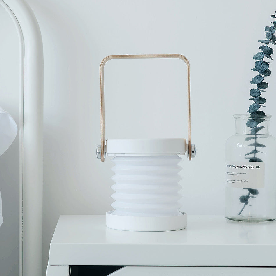 Lampe de nuit LED pliable, tactile et à intensité variable, rechargeable par USB, idéale pour la décoration intérieure.