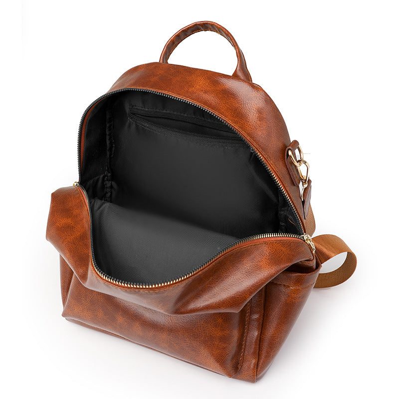 Sac à dos élégant pour femme, de couleur unie, idéal pour les trajets quotidiens et offrant une grande capacité.