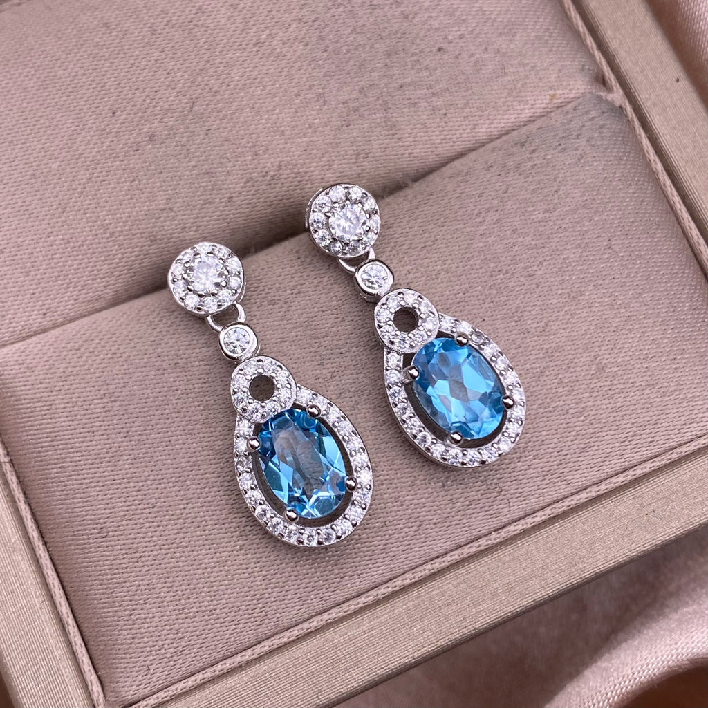 Boucles d'oreilles en topaze bleue serties de diamants en argent S925