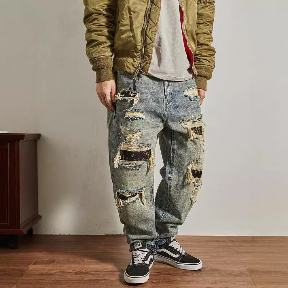 Jeans homme coupe droite ample et fuselée, effet usé et troué