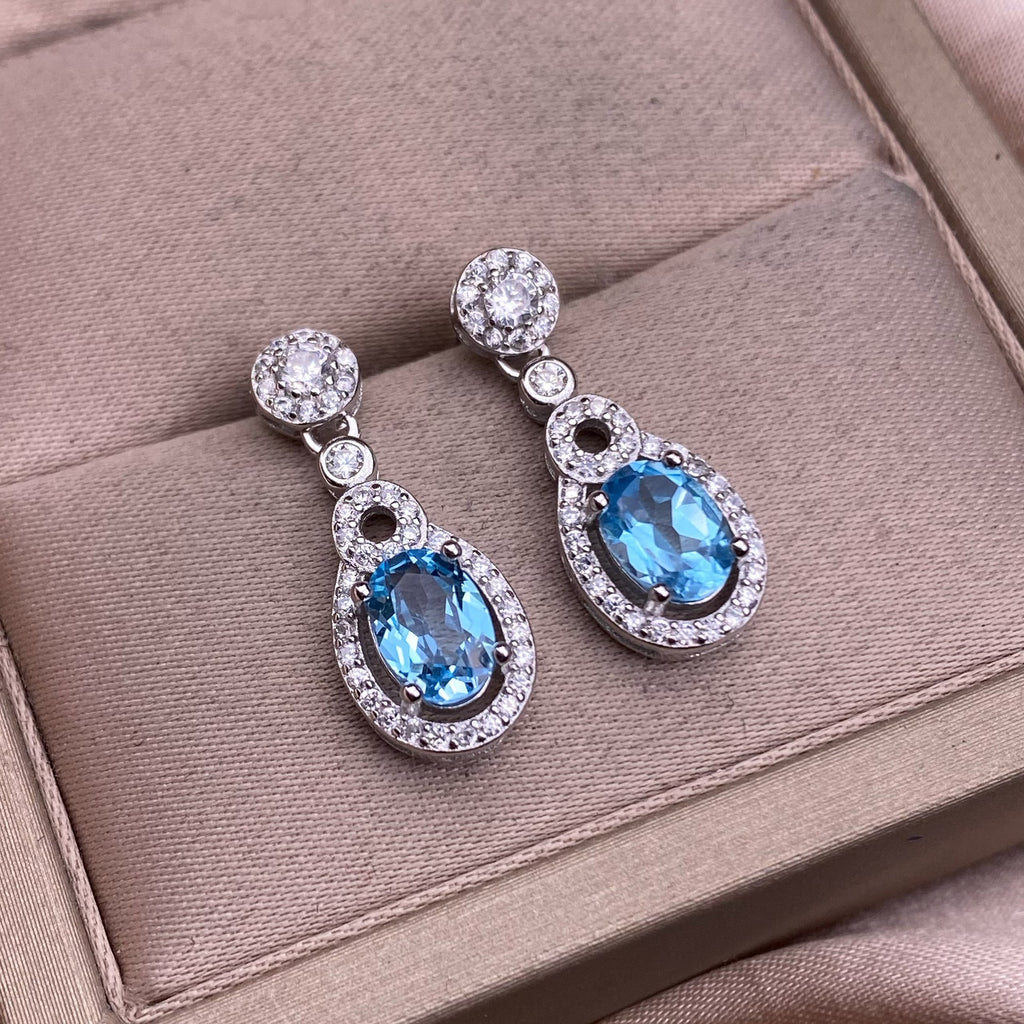 Boucles d'oreilles en topaze bleue serties de diamants en argent S925