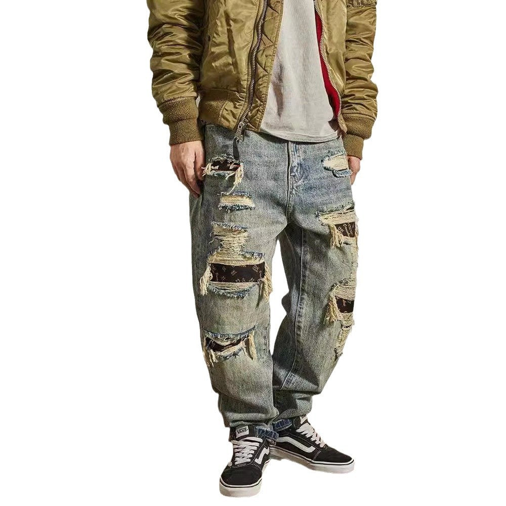 Jeans homme coupe droite ample et fuselée, effet usé et troué
