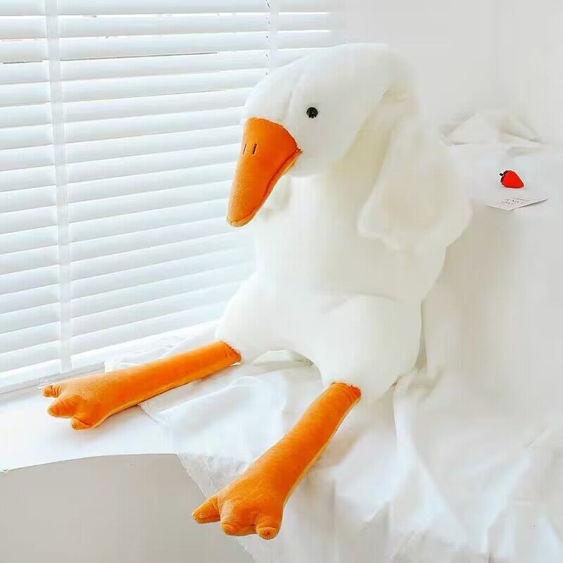 Coussin en peluche représentant une grosse oie blanche mignonne