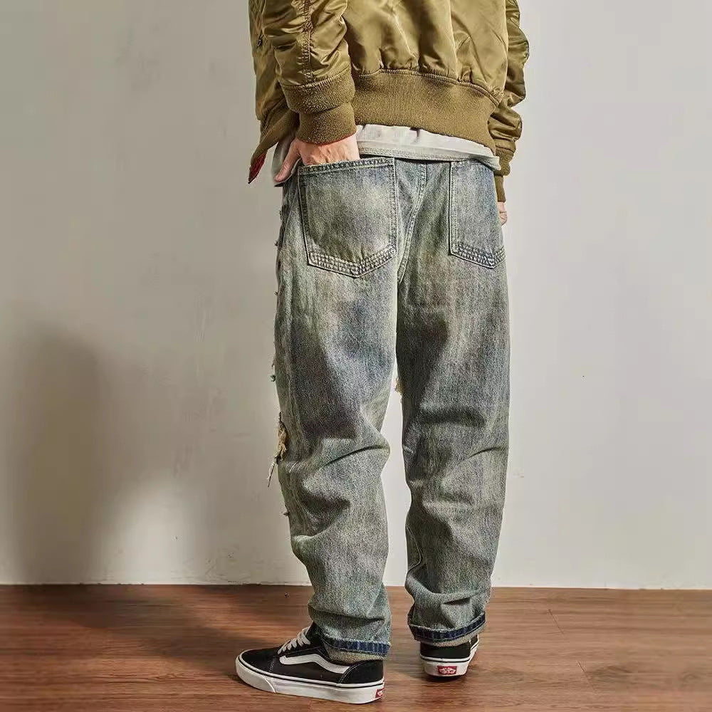 Jeans homme coupe droite ample et fuselée, effet usé et troué